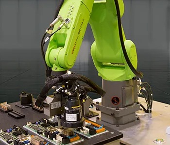 Figure 5: Robot inspecting PCB